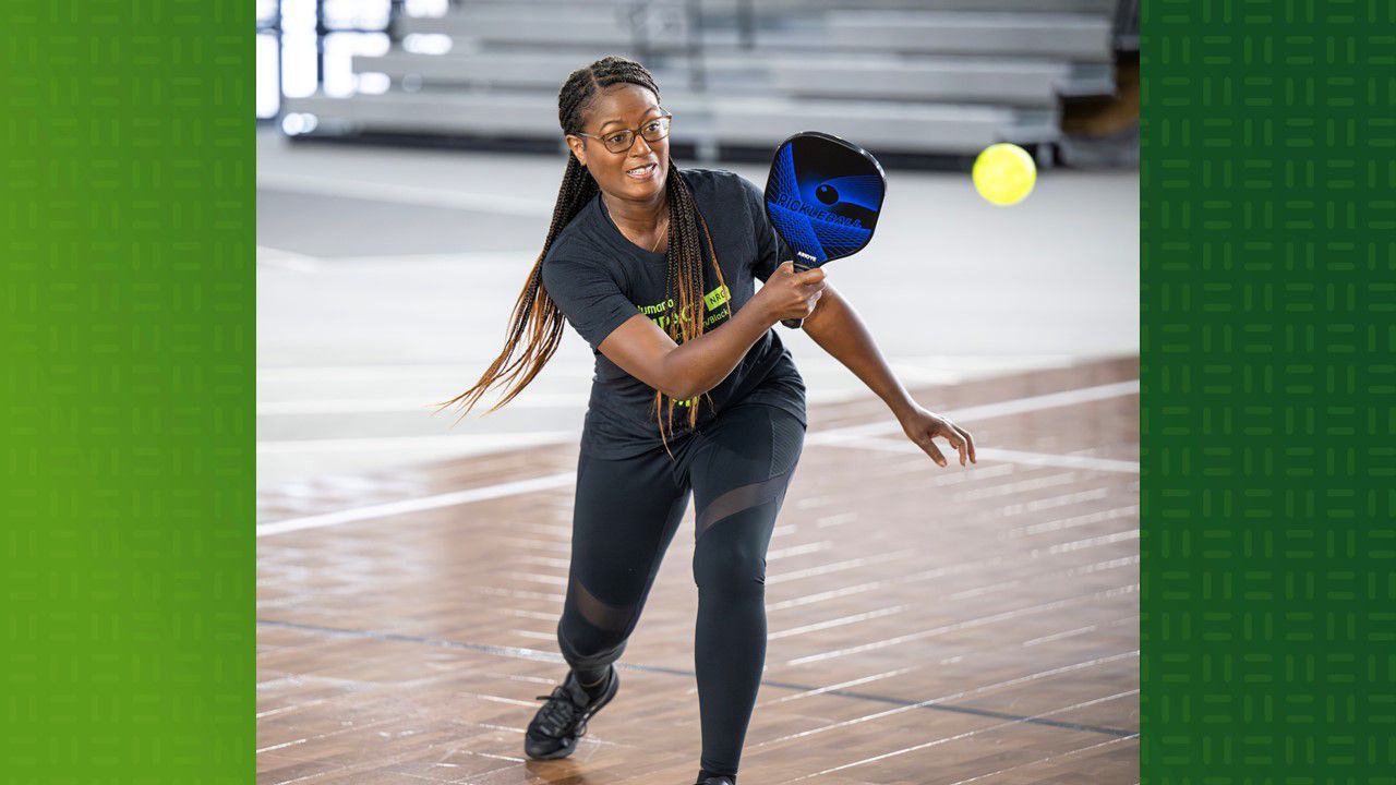 Black woman playing pickleball